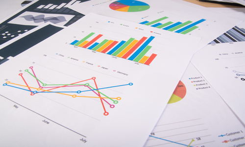 Business report. Graphs and charts. Business reports and pile of